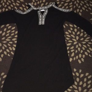 I am selling a black dress with White design